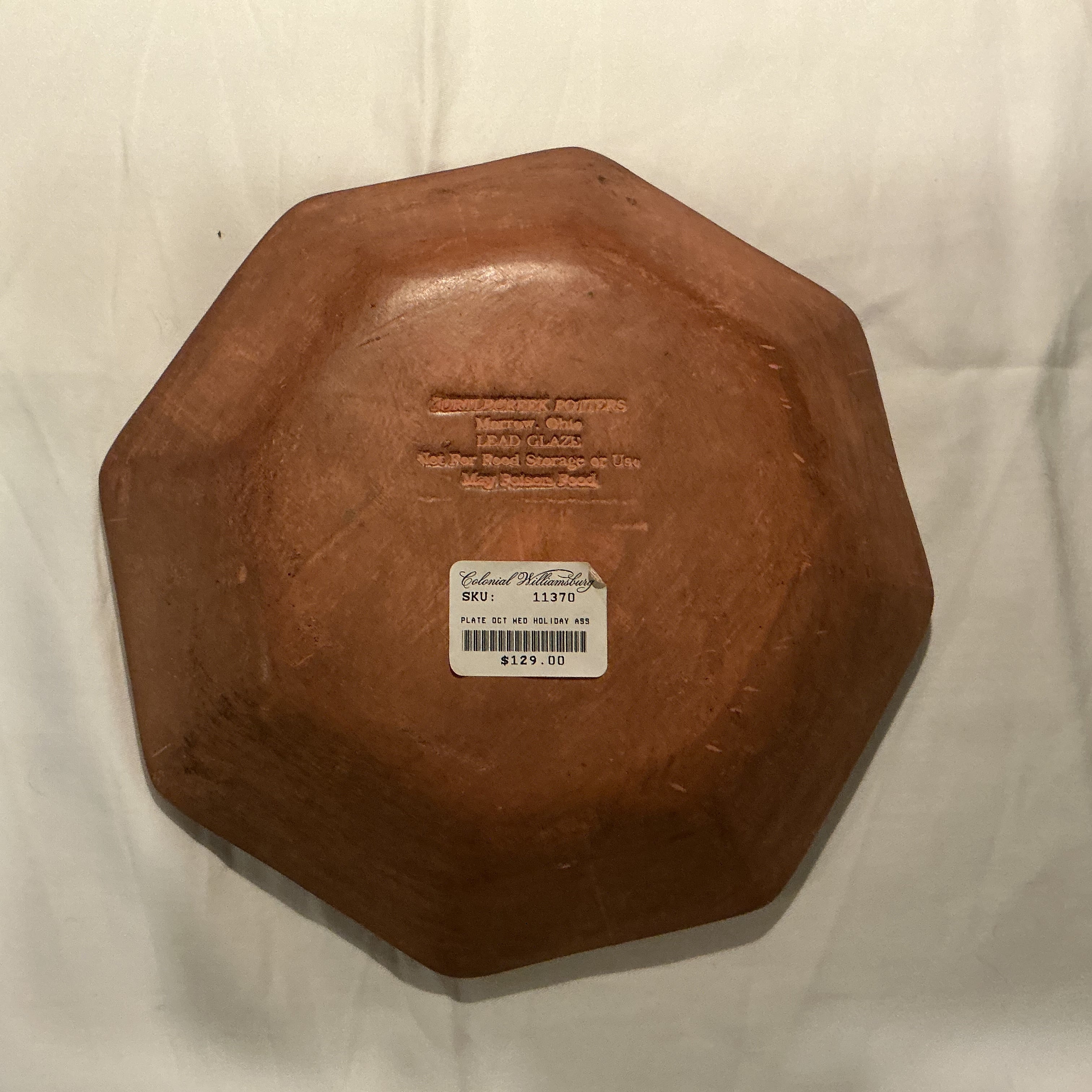 8.25” Redware dish by Turtlecreek Potters