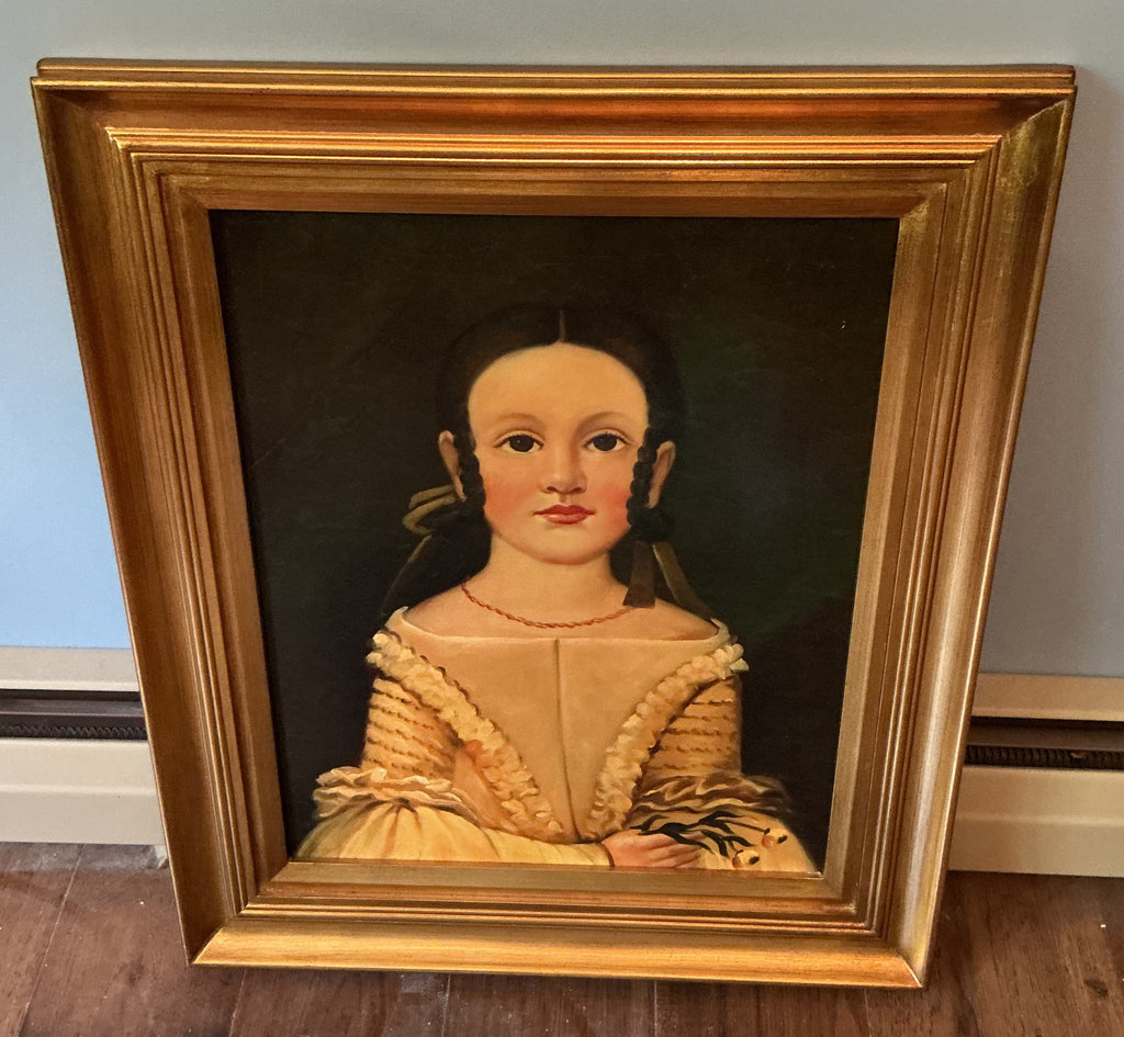 Picture on young girl in gold frame