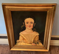Picture on young girl in gold frame