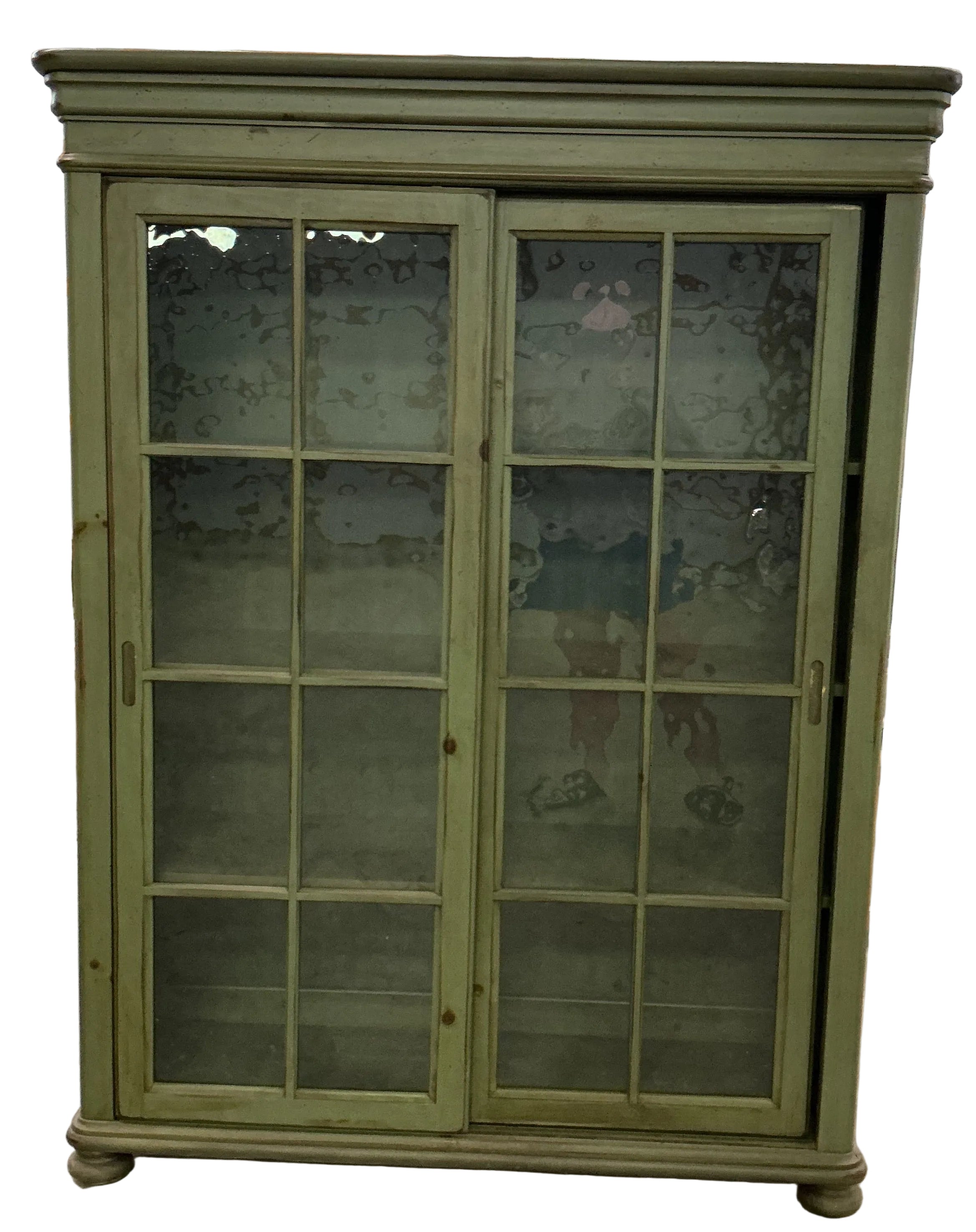 Green bookcase/display cupboard with 2 sliding doors.