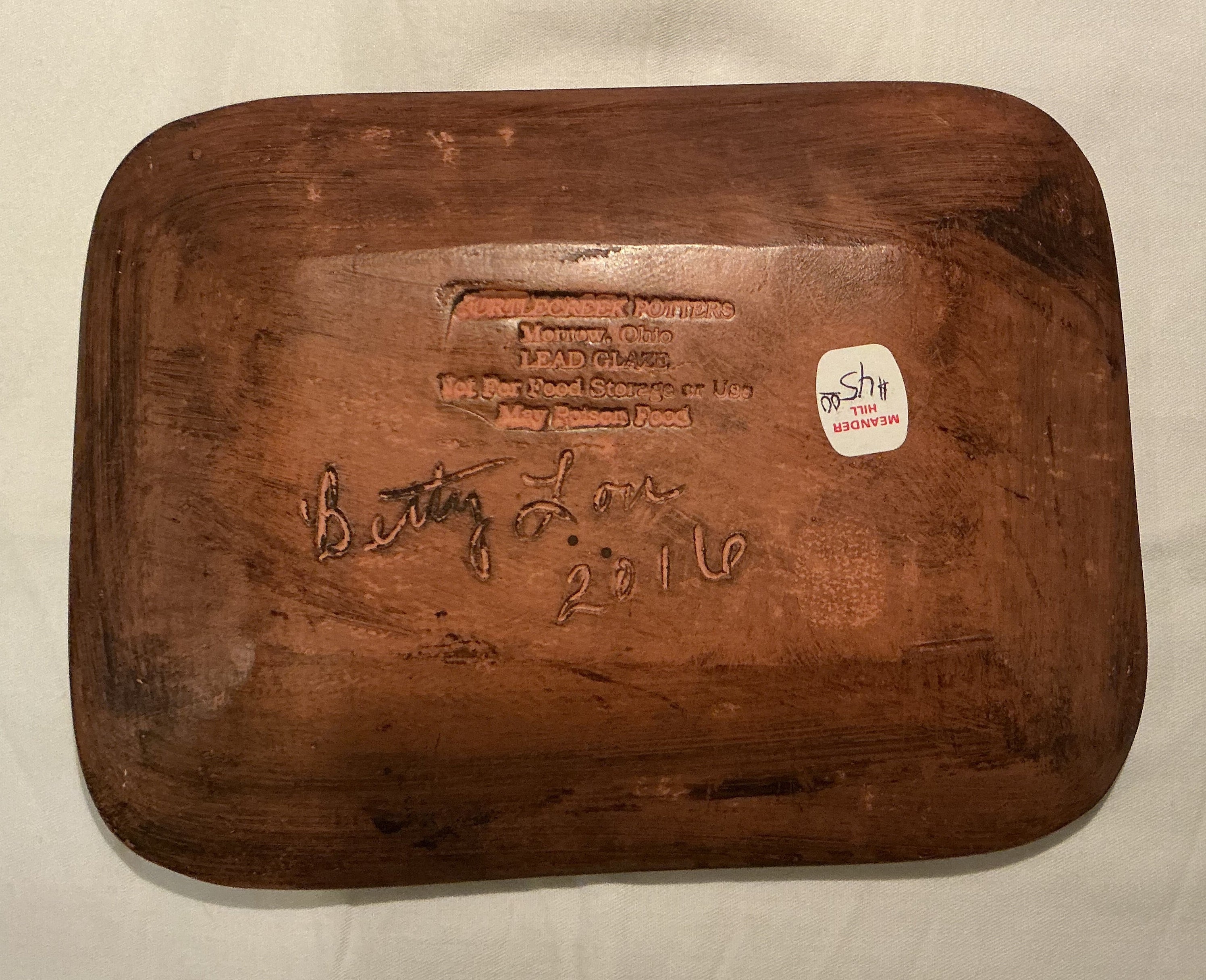 7.75” Redware plate by Betty Lou of Turtlecreek Pottery