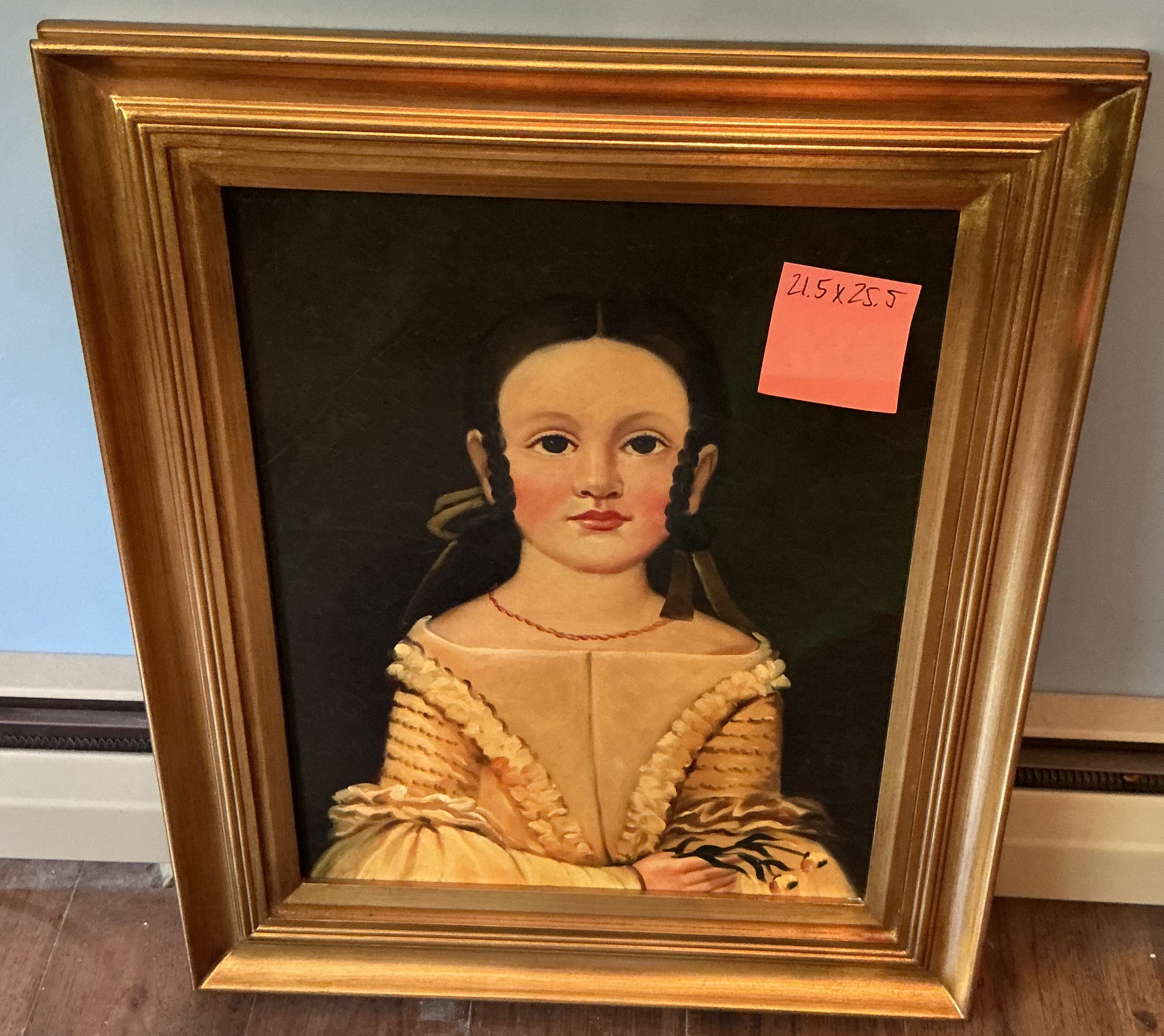 Picture on young girl in gold frame