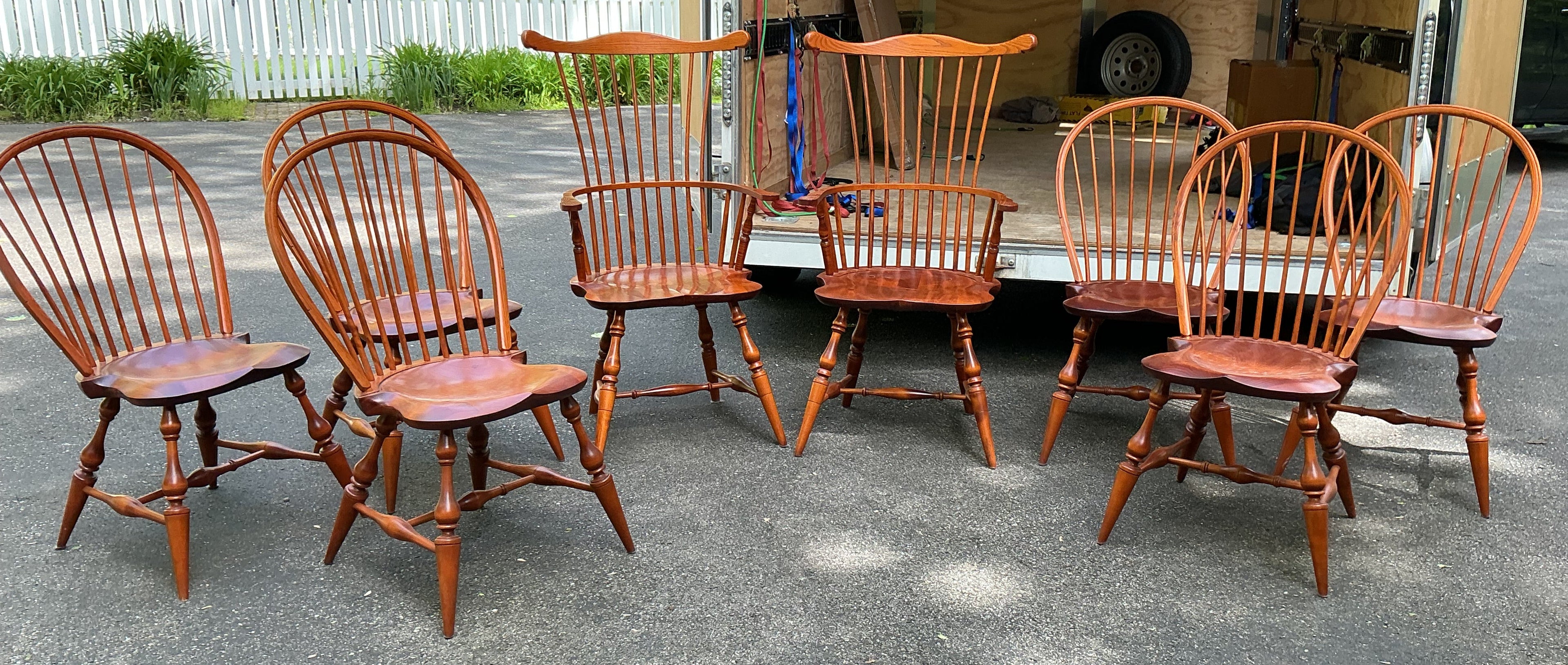2 fanback arm chairs and 6 bowback side chairs by J.L. Treharn