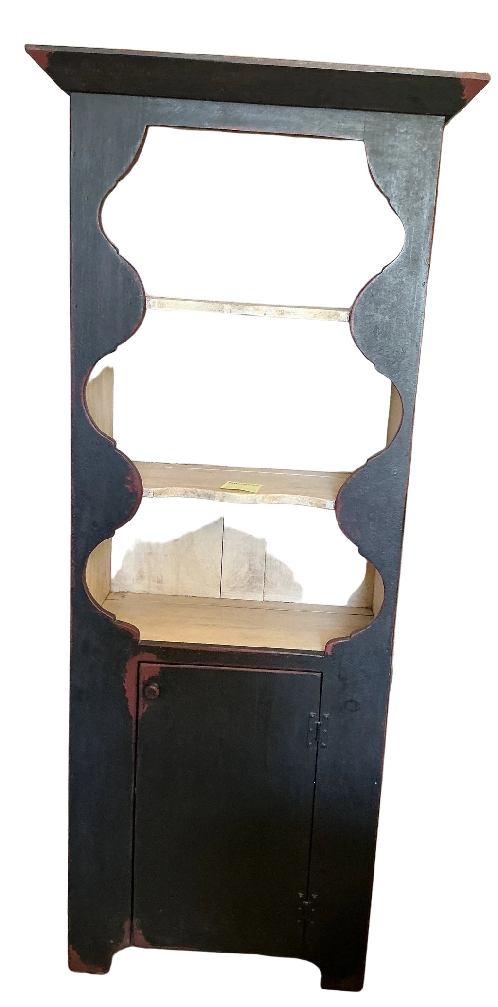 Scalloped wall cupboard in black over red